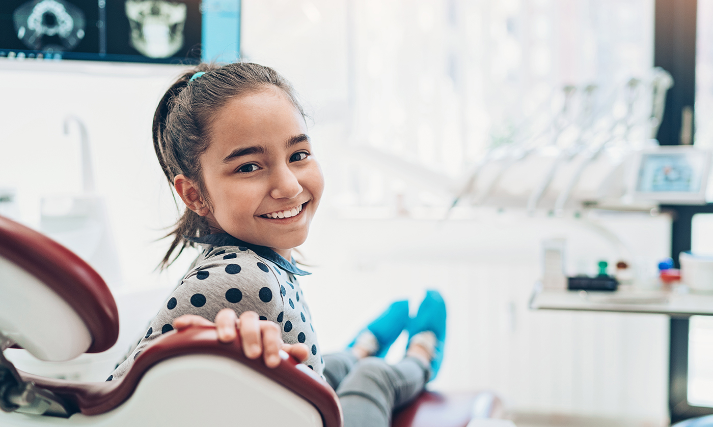 Young girl in dentist chair